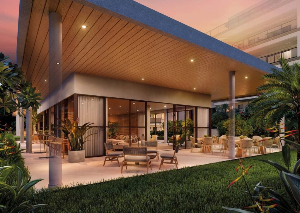 Fachada de um dos edifícios do Gaea Home Resort, com jardim no térreo