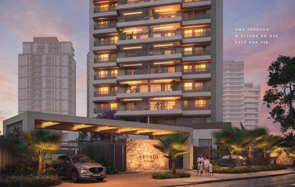 Fachada iluminada e porte-cochère do Kronos by Tegra na Avenida Afonso Arinos de Melo Franco, Barra da Tijuca